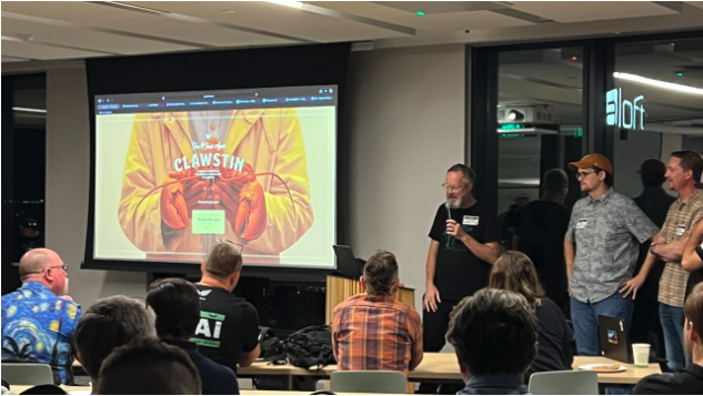 Clawstin event presentation with speakers on stage